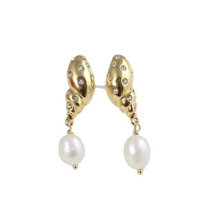 Kate Spade New York Conch pearl gold tone earrings.