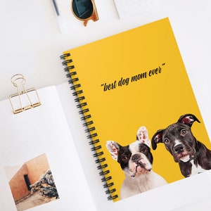 May include: A yellow spiral notebook with the text "best dog mom ever" in black. Two dogs, a French Bulldog and a Pitbull, are pictured on the cover. The French Bulldog is white with black markings and the Pitbull is black with brown markings.