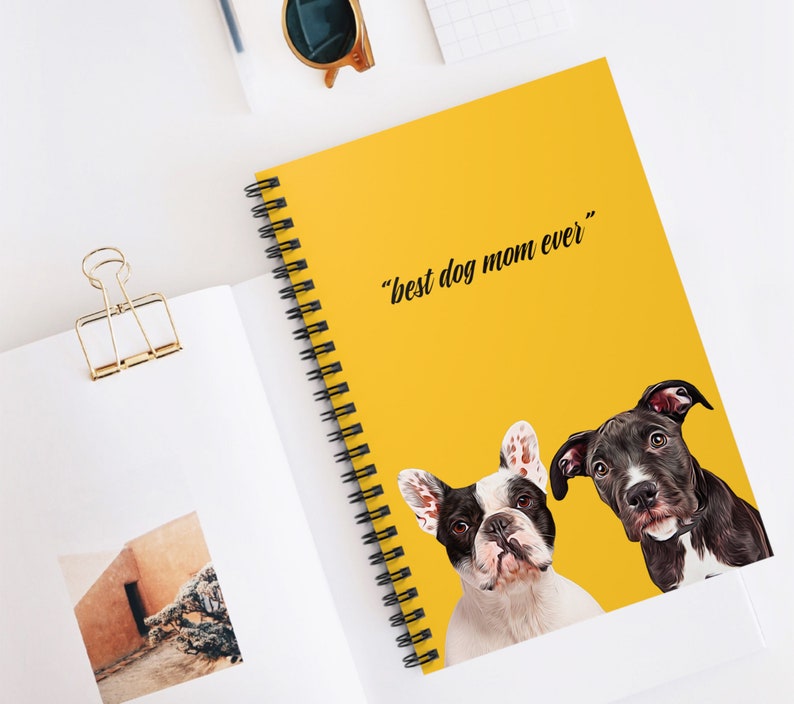 May include: A yellow spiral notebook with the text "best dog mom ever" in black. Two dogs, a French Bulldog and a Pitbull, are pictured on the cover. The French Bulldog is white with black markings and the Pitbull is black with brown markings.