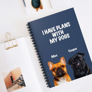 May include: A blue spiral notebook with the text "I have plans with my dogs" in white. The notebook features two dog photos, one of a French Bulldog named Max and one of a Pug named Cooper.