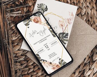 Könnte beinhalten: Ein Smartphone zeigt eine Hochzeitseinladung mit floralen und geometrischen Designs. Die Einladung enthält die Namen "Arber und Elijah", Datum, Uhrzeit und Ort. Eine passende Einladungskarte und ein Umschlag sind ebenfalls vorhanden, zusammen mit dekorativen Elementen.