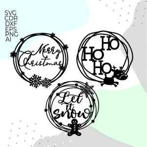 May include: Three black Christmas-themed wreath designs. One wreath says "Merry Christmas" with snowflakes. Another says "Ho Ho Ho" with a reindeer. The third says "Let it snow" with a gingerbread man.