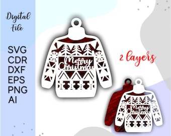 Könnte beinhalten: Ein weißes, zweilagiges, geschichtetes Papierschnittdesign eines Weihnachtspullovers mit dem Text "Merry Christmas" in der Mitte. Der Pullover hat ein Schneeflocken-, Baum- und geometrisches Muster.