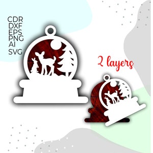 May include: White silhouette of a snow globe with a deer, rabbit, and pine tree inside. The snow globe is on a base with a blank space for text. The image says "2 layers" in red text.