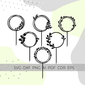 May include: Set of six black cake toppers with circular frames and floral designs. The toppers are perfect for adding a touch of elegance to any cake.