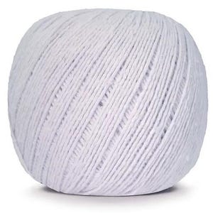May include: A ball of white cotton twine, tightly wound into a spherical shape. The twine is made of individual strands, creating a textured surface. The ball is sitting on a white background.