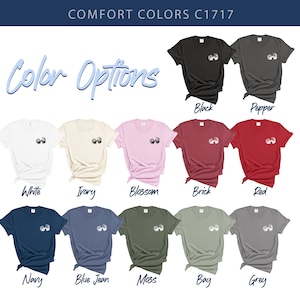 May include: A selection of t-shirts in various colors, including white, ivory, blossom, brick, red, navy, blue jean, moss, bay, and grey. Each shirt features a small graphic design on the front.