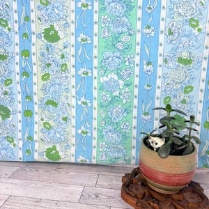 May include: A rustic wooden sign with the text "Welcome to our home" in white lettering. The sign features a distressed finish and a simple, inviting design, perfect for a front porch or entryway.