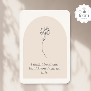 May include: A rectangular card with rounded corners features a minimalist line drawing of a flower. The card has a beige background with a light brown arch shape. Text on the card reads: "I might be afraid but I know I can do this."
