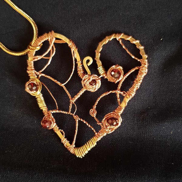 Brass and copper heart pendant with garnet beads (on chain)