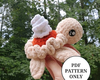 May include: Crochet pattern for a plush turtle with a white whipped cream topping. The pattern is available as a PDF download. The text "PDF PATTERN ONLY" is visible in the image.