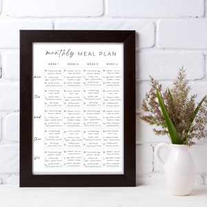 May include: A black framed printable monthly meal planner with a white background and black text. The planner is divided into four weeks, with each week having a daily meal plan for Monday through Friday. The meal plan includes breakfast, lunch, and dinner options.