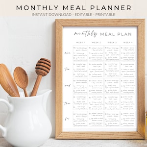May include: A printable monthly meal planner with a brown wooden frame. The planner is divided into four weeks and includes a list of meals for each day of the week. The text on the planner reads "monthly MEAL PLAN".