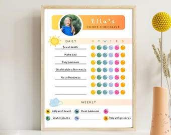 May include: A colorful printable chore checklist for kids with a yellow sun, blue clouds, and a photo of a girl. The checklist includes daily and weekly chores with a grid of circles for tracking progress. The text on the checklist reads "Ella's Chore Checklist".
