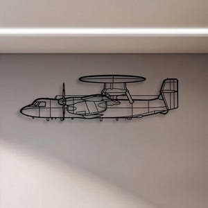 May include: A black metal wall art piece depicting an airplane with a large radar dome. The artwork is mounted on a light gray wall in an office setting. The airplane has detailed outlines of the fuselage, wings, and propellers.