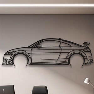 May include: Black metal wall art depicting a side profile of a sports car. The artwork is mounted on a light gray wall in an office setting. The car design includes details like the spoiler and front bumper.