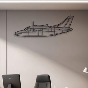 May include: A black metal wall art piece shaped like the side profile of a twin-engine airplane. The design features a clean, linear outline of the aircraft fuselage, wings, tail section, and cockpit windows, creating a minimalist silhouette.