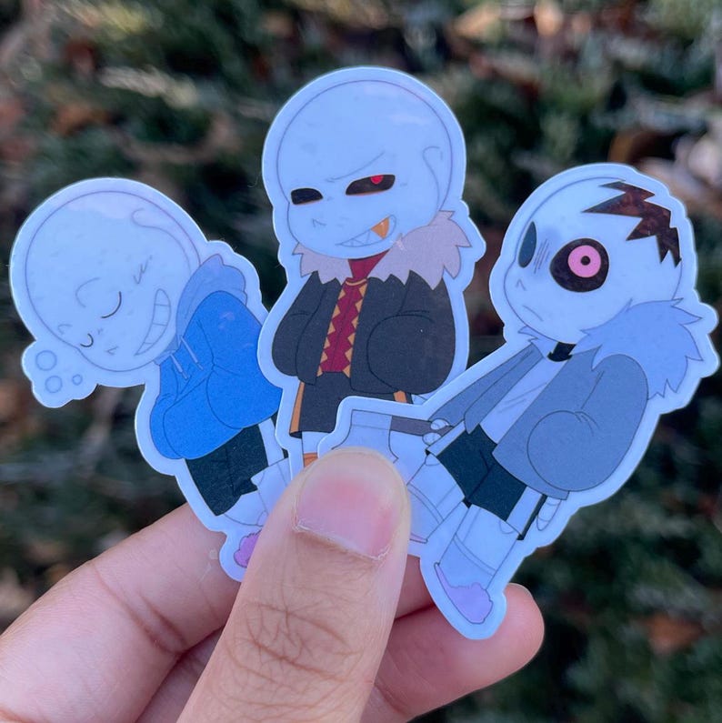 Three skeletons. The one on the left has a sleepy expression, the one in the middle has a toothy grin, and the one on the right is staring blankly at the viewer.