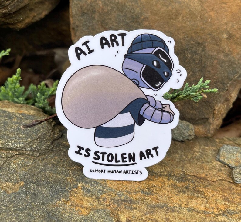 A sticker of a robot holding a bag over his shoulder.