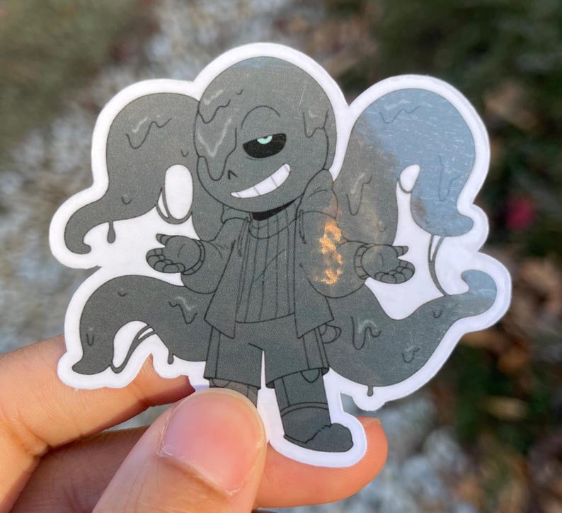 A sticker of a black skeleton that is dripping and has four tentacles coming from his back.
