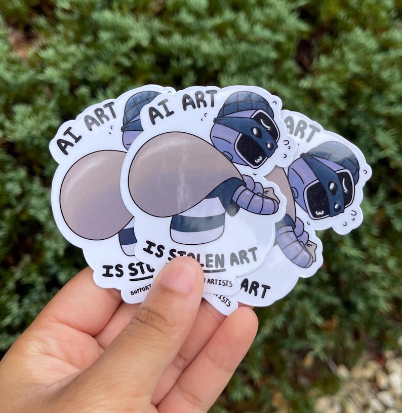 A sticker of a robot holding a bag over his shoulder.