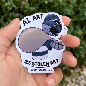 A sticker of a robot holding a bag over his shoulder.