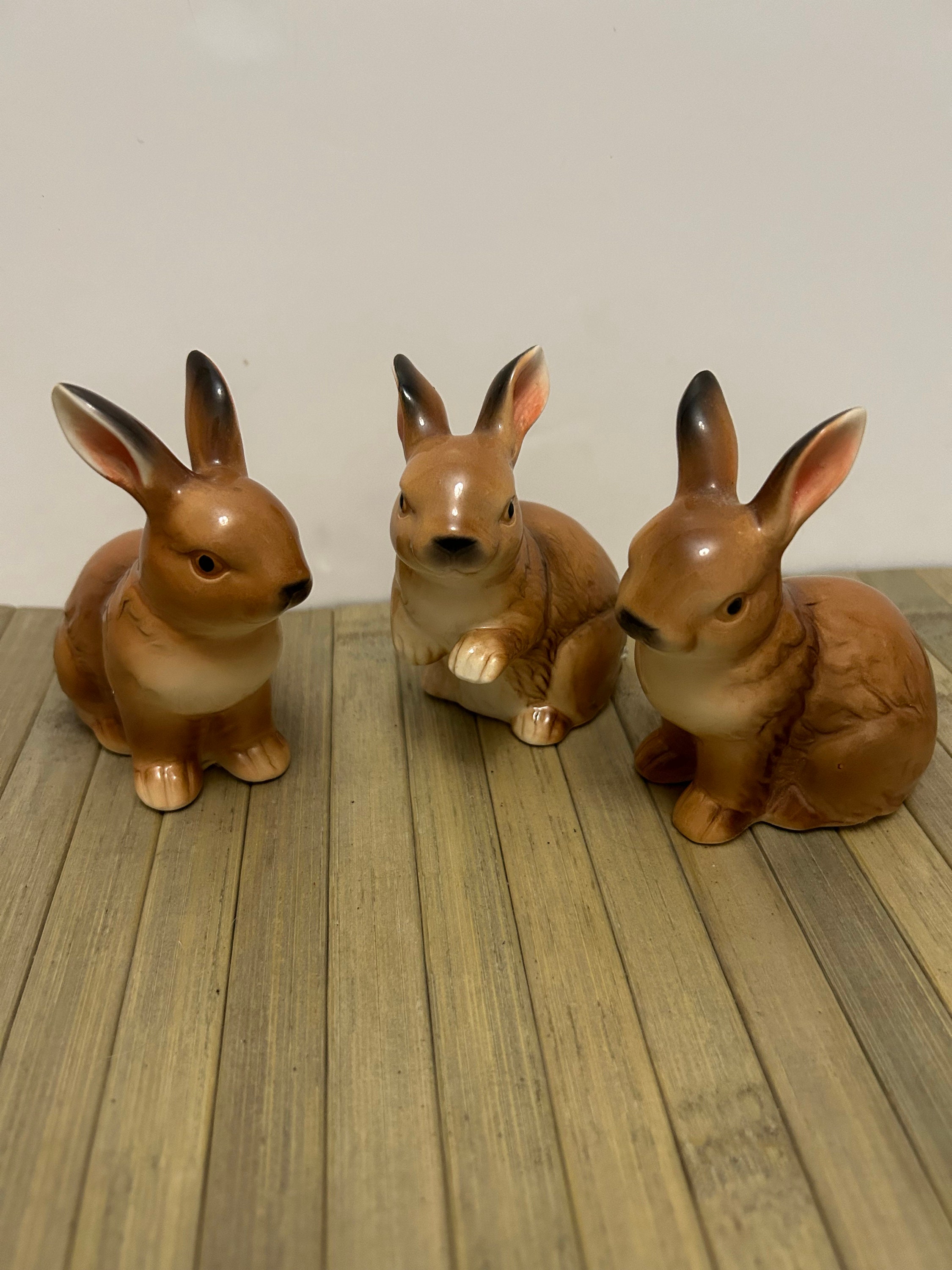 A trio of vintage ceramic rabbits rabbit ornaments