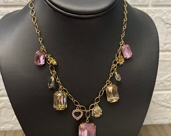 vintage Avon gold tone SH necklace with pink acrylic crystals and gold tone charms 22 inch adjustable