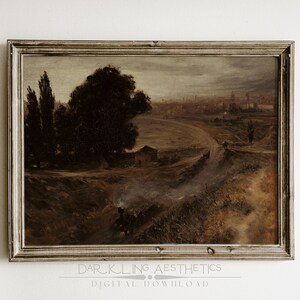 May include: A vintage painting in a wooden frame depicts a landscape with a winding road leading to a city in the distance. The painting is done in muted tones of brown, green, and gray, with a hazy sky.