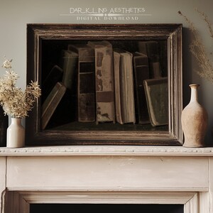May include: A framed print of a still life featuring a collection of antique books with brown leather covers. The print is displayed on a white mantelpiece with a vase of dried flowers and two other decorative vases.