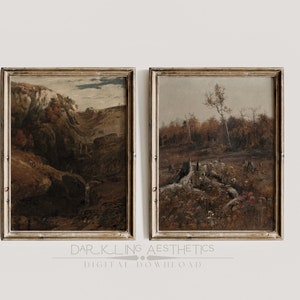 May include: Two framed landscape paintings with a rustic aesthetic. The first painting depicts a rocky, wooded hillside with a stream running through it. The second painting shows a forest clearing with a large tree stump and fallen trees.