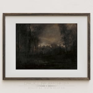 May include: A framed print of a dark, moody landscape painting. The painting depicts a forest scene with trees and a body of water in the foreground. The sky is a muted orange and gray, suggesting a sunset or twilight.