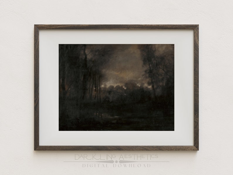 May include: A framed print of a dark, moody landscape painting. The painting depicts a forest scene with trees and a body of water in the foreground. The sky is a muted orange and gray, suggesting a sunset or twilight.
