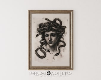 May include: A black and white drawing of a woman with snakes in her hair. The woman's face is visible and she has a sad expression. The drawing is framed in a gold frame.