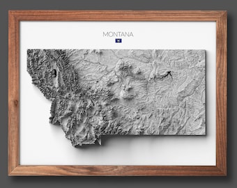 May include: A framed, 3D relief map of Montana, with a grayscale color scheme. The state flag is displayed in the top right corner of the frame.