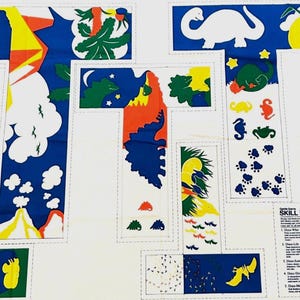 May include: A white fabric with colorful dinosaur and nature-themed illustrations. The design includes various shapes and sizes of dinosaurs, trees, clouds, and stars in blue, green, yellow, and red. The words "Skill Builders" are also visible.