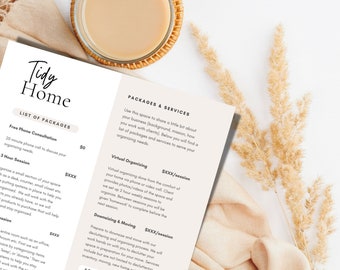 May include: A close-up of a printed document with the title "Tidy Home" and a list of packages and services for home organization. The document is on a white surface with a cup of coffee and a dried flower arrangement.