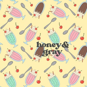 Puede incluir: Patrón repetitivo de batidos, cucharas y cerezas sobre un fondo amarillo claro. Los batidos son rosas, verdes y marrones, con crema batida y una cereza. El texto "honey & gray" está en el centro.