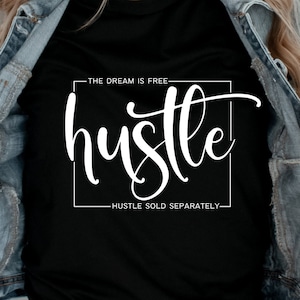 May include: A black t-shirt with white text that reads "THE DREAM IS FREE- hustle HUSTLE SOLD SEPARATELY-"