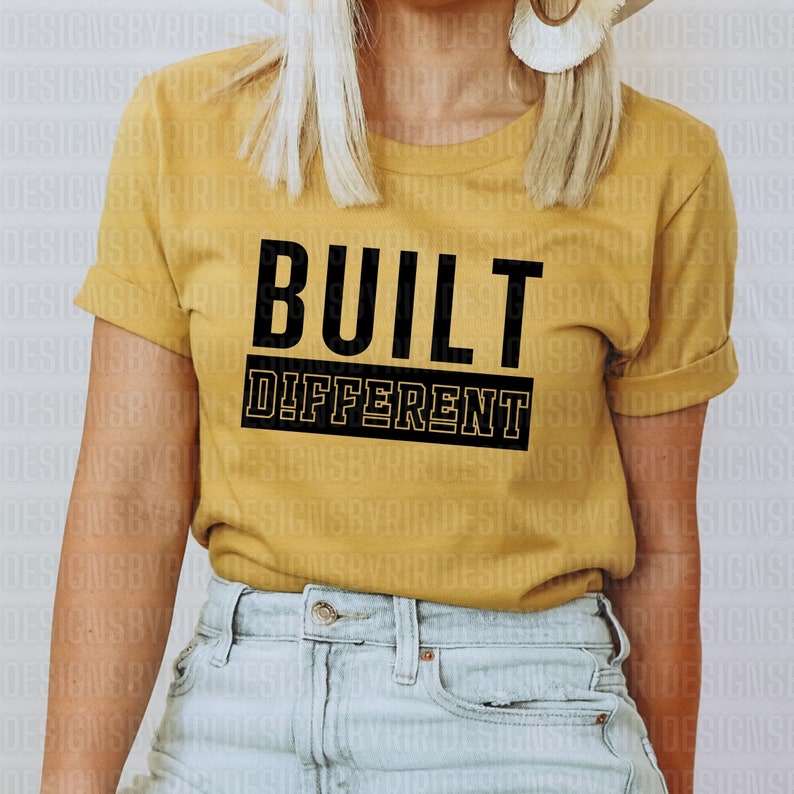 May include: A yellow t-shirt with the text "BUILT DIFFERENT" in black letters.