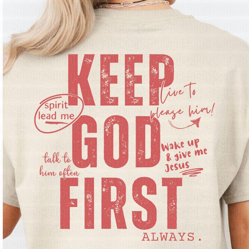 May include: A beige t-shirt with a red graphic print that says "KEEP GOD FIRST ALWAYS." The graphic includes additional text, "spirit lead me", "talk to him often", "live to please him!" and "wake up & give me Jesus".