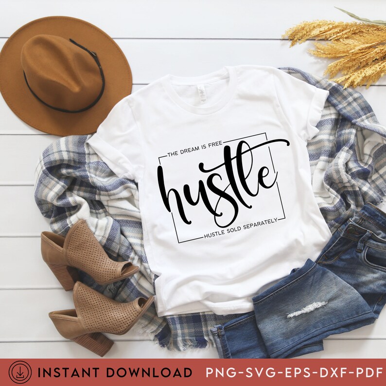 May include: White t-shirt with black text that reads "THE DREAM IS FREE hustle HUSTLE SOLD SEPARATELY- "