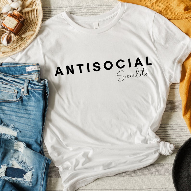 May include: White t-shirt with black text that reads "ANTISOCIAL Socialite".