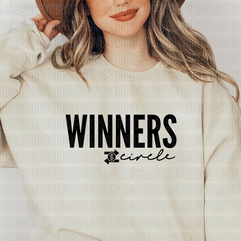 May include: A white sweatshirt with the text "WINNERS circle" in black lettering. The text "circle" is written in cursive and includes a dollar sign and arrow graphic.