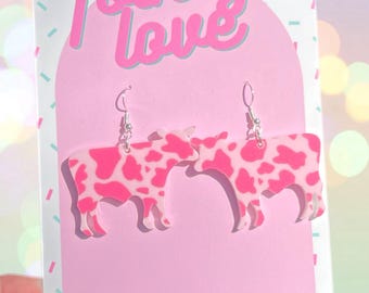 Pink cow print acrylic heart earrings