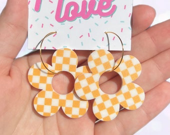 Orange checkered daisy acrylic hoop earrings