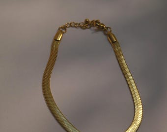 Elegante bracciale a spina di pesce in oro