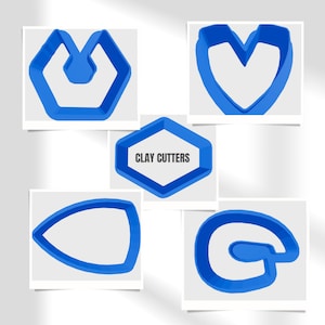 May include: Five blue plastic clay cutters in the shape of a heart, a letter G, a football, a hexagon with the text "CLAY CUTTERS", and a geometric shape with a rounded top.
