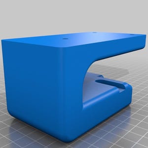 May include: A solid blue, rectangular bracket with a curved cutout and a small, rectangular notch. The top surface has three small, evenly spaced holes. The bracket is designed to be mounted on a surface.