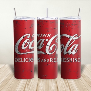 May include: Three red and white stainless steel tumblers with a vintage Coca-Cola design. The tumblers have a distressed look and feature the text "Drink Coca-Cola Delicious and Refreshing".